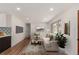 Virtually staged living room featuring hardwood floors and natural light at 2702 Atchison St, Aurora, CO 80011