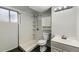 Bathroom with shower stall, tiled walls, modern vanity, and toilet at 2122 S Yank Way, Lakewood, CO 80228