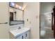 Bathroom with a vanity and a large mirror and view to the bedroom at 2122 S Yank Way, Lakewood, CO 80228