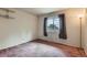 Bedroom featuring neutral walls, carpet, and a large window for natural light at 2122 S Yank Way, Lakewood, CO 80228
