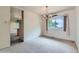 Dining room featuring a large picture window and modern chandelier lighting at 2122 S Yank Way, Lakewood, CO 80228
