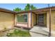 Home entrance with protected metal gate and xeriscaped flower bed awaiting your finishing touch at 2122 S Yank Way, Lakewood, CO 80228