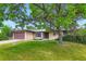 Charming one story ranch home featuring a two-car garage and mature landscaping at 2122 S Yank Way, Lakewood, CO 80228