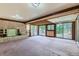 Brick fireplace and large sliding doors that provide ample natural light at 2122 S Yank Way, Lakewood, CO 80228