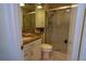 Bathroom featuring vanity with granite countertop and tiled shower at 3131 E Alameda Ave # 1604, Denver, CO 80209