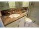 Bathroom with granite vanity countertop and glass shower at 3131 E Alameda Ave # 1604, Denver, CO 80209
