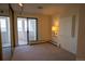 Bedroom featuring large mirrored closet and balcony access at 3131 E Alameda Ave # 1604, Denver, CO 80209