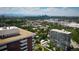 Scenic aerial view of the city skyline with lush greenery and clear blue skies, showcasing urban living at 3131 E Alameda Ave # 1604, Denver, CO 80209
