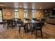 Bright dining area featuring tables with chairs, large windows, and modern decor, perfect for gatherings at 3131 E Alameda Ave # 1604, Denver, CO 80209