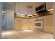 Bright kitchen featuring granite countertops, white appliances, white tile flooring, and recessed lighting at 3131 E Alameda Ave # 1604, Denver, CO 80209