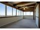 Bright living room with floor to ceiling windows and beautiful wood beam ceiling at 3131 E Alameda Ave # 1604, Denver, CO 80209