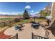Outdoor patio with seating area, fire pit, and mountain views at 1678 S Parkdale Cir, Erie, CO 80516