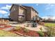Charming backyard patio with a fire pit and outdoor seating, perfect for entertaining and relaxation at 1678 S Parkdale Cir, Erie, CO 80516