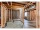 Unfinished basement space with framed rooms, insulated walls, and window at 1678 S Parkdale Cir, Erie, CO 80516