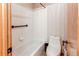 Bright bathroom featuring a toilet, bathtub and shower combination at 1678 S Parkdale Cir, Erie, CO 80516