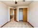Bright bedroom with neutral carpet and walk-in closet with sliding doors at 1678 S Parkdale Cir, Erie, CO 80516