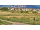 Scenic community view with hot air balloons in the distance and mountain views at 1678 S Parkdale Cir, Erie, CO 80516
