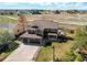 Beautiful exterior with a three-car garage, a covered front porch, and an outdoor seating area at 1678 S Parkdale Cir, Erie, CO 80516