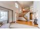 Grand foyer featuring high ceilings, a staircase, hardwood floors, and ample natural light at 1678 S Parkdale Cir, Erie, CO 80516