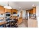 Spacious kitchen featuring stainless steel appliances, a kitchen island, and adjacent dining area with plenty of cabinets at 1678 S Parkdale Cir, Erie, CO 80516