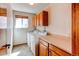 Functional laundry room with side-by-side washer and dryer, built-in cabinets, and laminate countertop at 1678 S Parkdale Cir, Erie, CO 80516