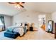 Spacious main bedroom with a large bed, vaulted ceiling, and ensuite bathroom with dual sinks at 1678 S Parkdale Cir, Erie, CO 80516