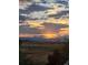 Scenic sunset view with mountain vista at 1678 S Parkdale Cir, Erie, CO 80516