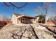 Spacious backyard with covered patio for outdoor entertaining and relaxation at 152 Pelican Ave, Brighton, CO 80601