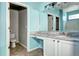 Full bathroom with dual sinks and decorative vanity at 152 Pelican Ave, Brighton, CO 80601