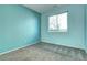 Neutral bedroom with ample natural light from a large window at 152 Pelican Ave, Brighton, CO 80601