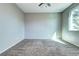Bedroom with neutral carpet, window and ceiling fan at 152 Pelican Ave, Brighton, CO 80601