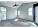 Spacious bedroom with carpet flooring, a vaulted ceiling, and an attached bathroom at 152 Pelican Ave, Brighton, CO 80601
