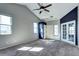 Spacious bedroom with carpet flooring, a vaulted ceiling, and natural light at 152 Pelican Ave, Brighton, CO 80601