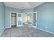 Bedroom featuring carpet flooring, neutral walls, and french doors at 152 Pelican Ave, Brighton, CO 80601