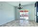 Dining room area with chandelier and sliding glass door to backyard patio at 152 Pelican Ave, Brighton, CO 80601