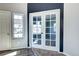 Bright entryway featuring neutral walls, carpet flooring, and natural light at 152 Pelican Ave, Brighton, CO 80601