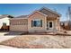 Charming single-Gathering home with a well-manicured lawn and attached two-car garage at 152 Pelican Ave, Brighton, CO 80601