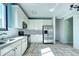 Kitchen featuring stainless steel appliances and tile flooring at 152 Pelican Ave, Brighton, CO 80601