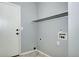 Neutral laundry room featuring a door to the outside at 152 Pelican Ave, Brighton, CO 80601