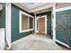 Inviting front entrance with a cozy porch and stylish door hardware and fall decor at 9118 W 50Th Ln # 3, Arvada, CO 80002