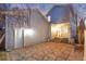 Stone patio with access to the back of the house, featuring an exterior door and sliding glass door at 2550 Xanthia Ct, Denver, CO 80238