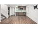 Finished basement featuring modern kitchenette, laundry closet, and stylish flooring at 2550 Xanthia Ct, Denver, CO 80238
