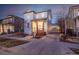 Exterior view of home with a long driveway and two-car garage at 2550 Xanthia Ct, Denver, CO 80238