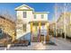 Two story home has welcoming front porch with wood pillars and porch swing at 2550 Xanthia Ct, Denver, CO 80238