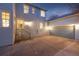 Exterior view of a light blue house featuring a two-car garage and a concrete driveway at dusk at 2550 Xanthia Ct, Denver, CO 80238
