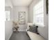 Cozy hallway nook with a plush bench, decorative pillow, and ample natural light for a relaxing spot at 2550 Xanthia Ct, Denver, CO 80238
