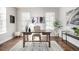 Bright home office featuring a wood desk, stylish chair, and modern decor for a productive workspace at 2550 Xanthia Ct, Denver, CO 80238