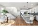 Bright, modern kitchen with stainless steel appliances, large island, and hardwood floors at 2550 Xanthia Ct, Denver, CO 80238