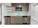 Close up of the basement kitchenette showcasing stainless steel appliances and a modern design at 2550 Xanthia Ct, Denver, CO 80238