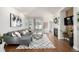 Bright living room with modern decor, fireplace, and hardwood floors at 2550 Xanthia Ct, Denver, CO 80238
